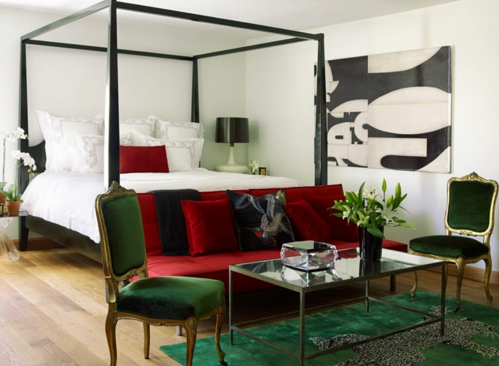 Green and red bedroom with sitting area 1024x752