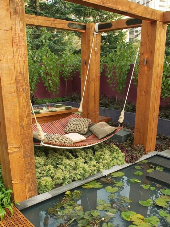 Hanging oversized hammock over pond