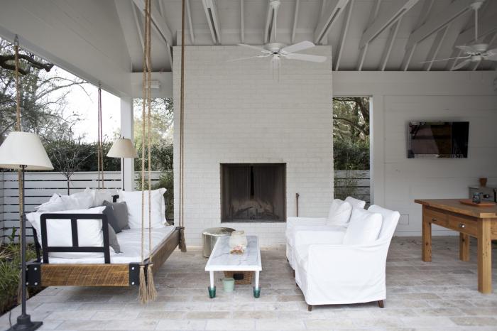 White painted fireplace bricks for porch and swing bed