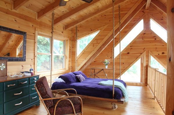 Wood attic room multiple windows hanging bed
