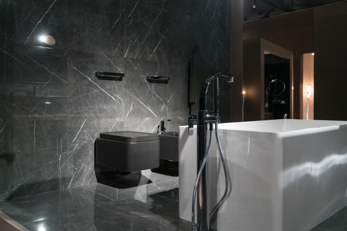Gray marble and black accessories make a bathroom look nice