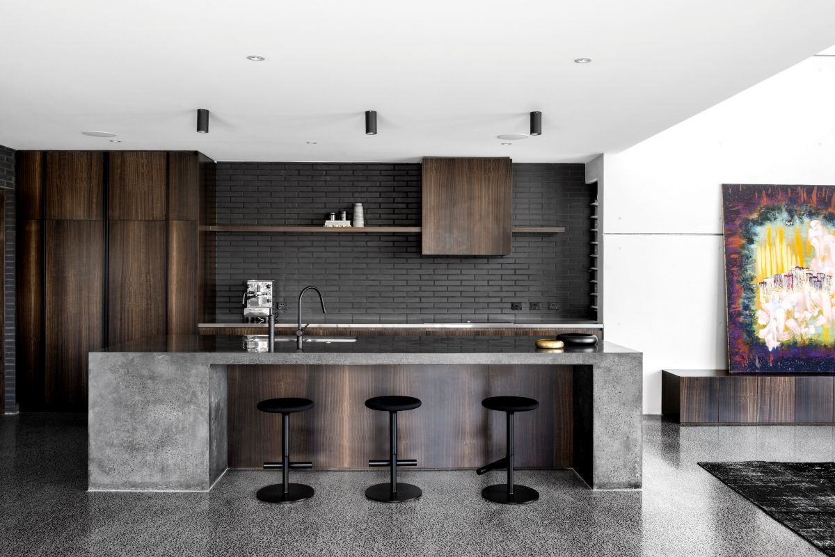 Concrete countertop for island and black kitchen tiles