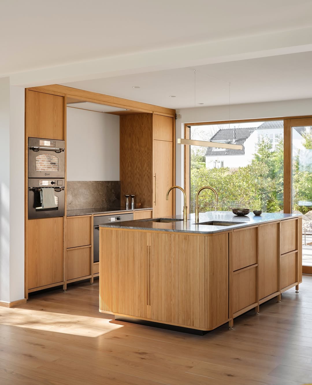 Kitchen island dark countertop and wood lower cabinets
