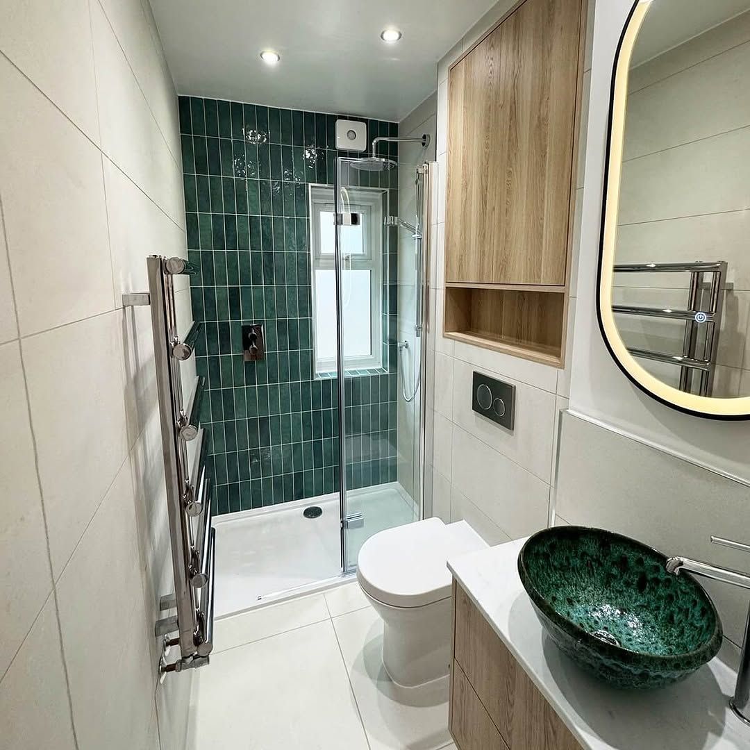 Compact Bath with Deep Green Shower Wall