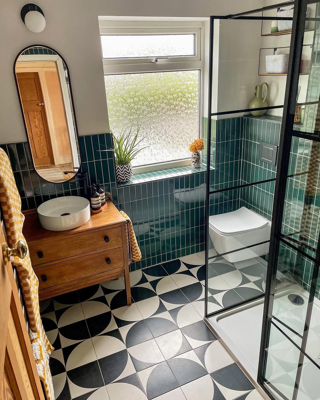 Graphic Floor Bath with Teal Tile