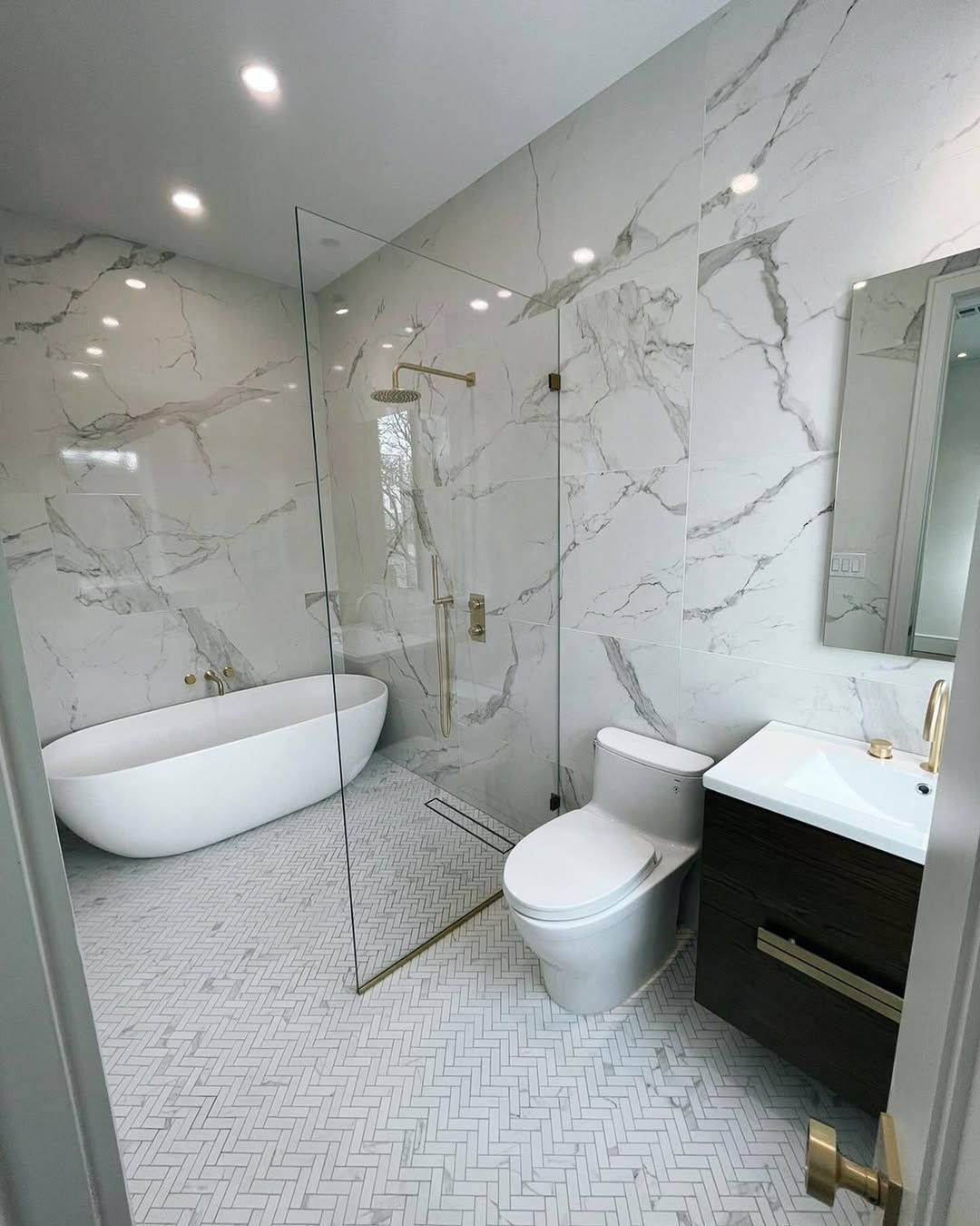 Marble Walk In Shower with Brass Fixtures