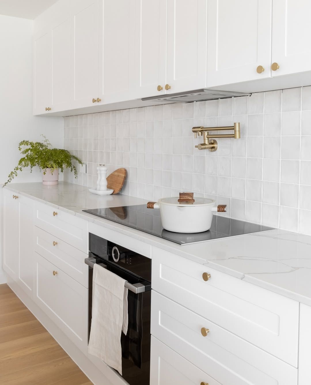 Matte Brass Pot Filler on Square Tile