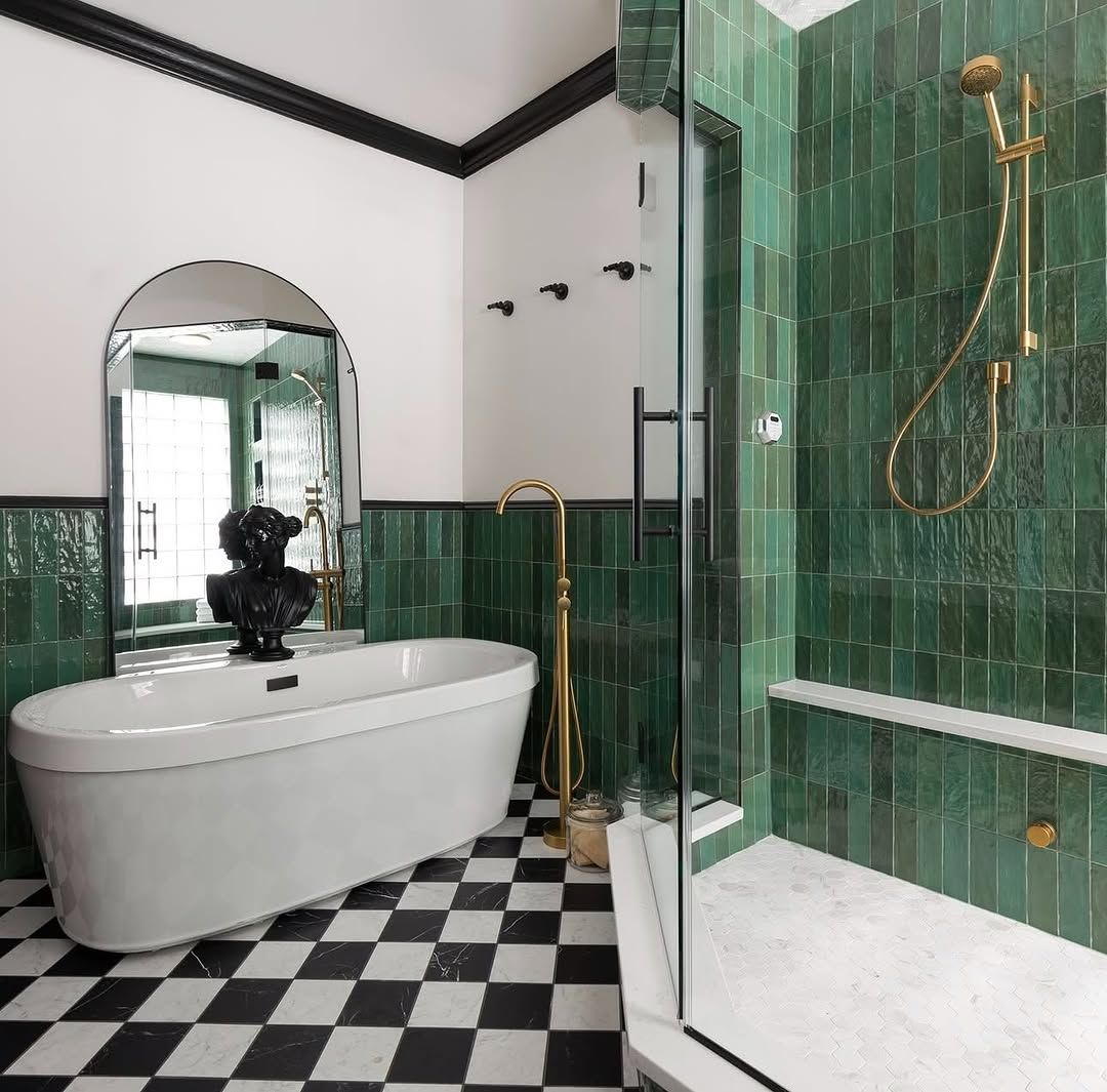 Tile With Black Trim and Brass Fixtures